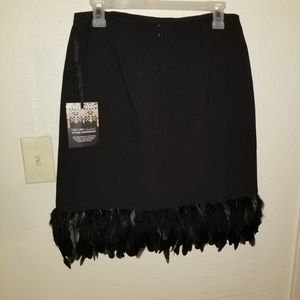 Black skirt with feathers on bottom